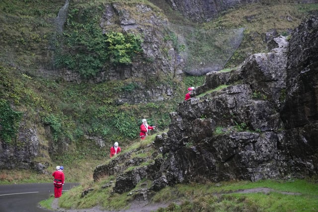 Santas abseil Cheddar Gorge for charity