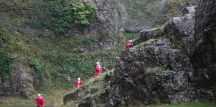 Santas abseil Cheddar Gorge for charity