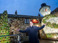 Britain's most festive pub is homed to 26-foot snowman - video