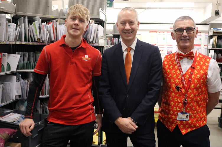 Wellington MP Gideon Amos is pictured with postmen Sam Cox (left), from Wellington, and Sean Monk, one of the managers of the Taunton sorting office.
