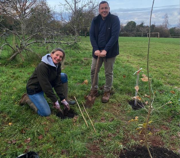 Wellington Town Council facilities manager Annette Kirk and open spaces manager Darren Hill planting trees in one of the town's green spaces. PHOTO: WTC.