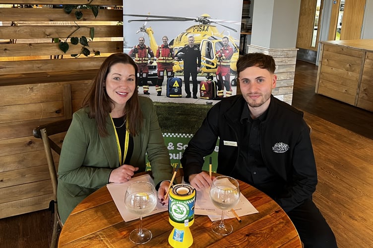 Charlotte Humber, supporter engagement officer from Dorset and Somerset Air Ambulance with Peppe Carullo, cafe manager at Rumwell