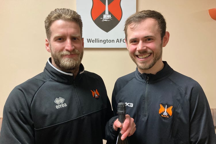 Wellington's Man of the Match Glen Wright (right) receives his award from injured goalkeeper Jake Viney on behalf of sponsors and former players Barry and Tony Knott