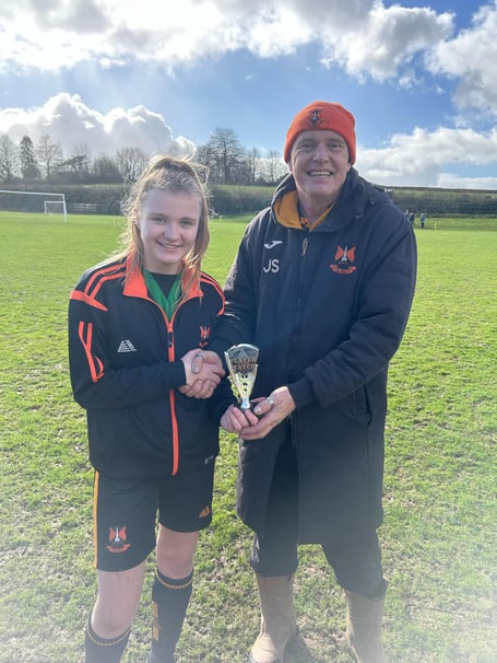 Four-goal Lola Hamlyn with John Sellick, head of Wellington Wildcats' section.