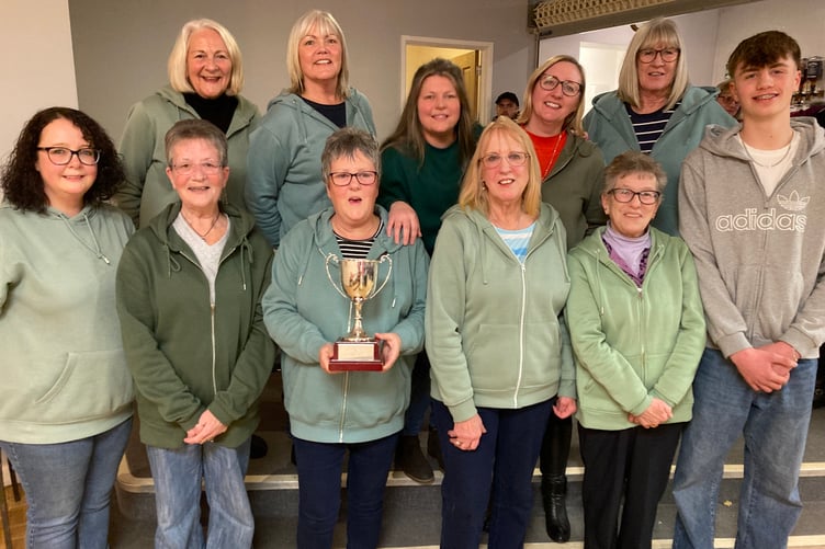 Split Pins, back left to right: Viv Fordham, Pauline Wadham, Bev Jones, Lisa Tucker, Tina Pengelly, Byron Powell (sticker-up): front: Lisa Mace, Nicky Bright, Helen Winter, Sue Chubb, Jo Fenn.