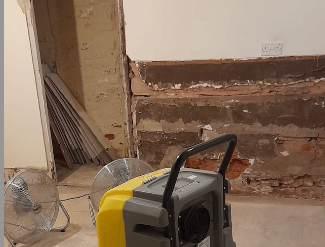 A room at Ditchford Cottages being dried after severe flooding damaged the home's interior