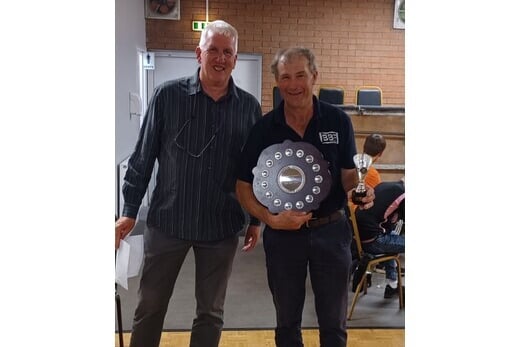 Defending singles champion John Barker (right)