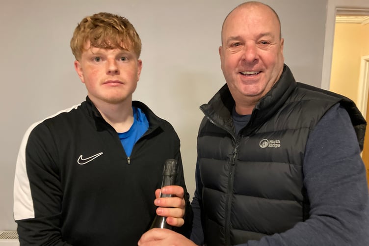 Wellington's Man of the Match Jack Winsor receives his award from supporter Paul Conn,  who sponsored the game.