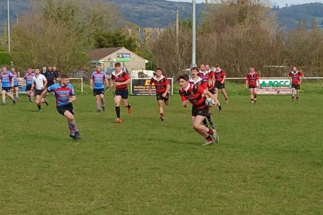 Flying Full Back Tom Slade with ball in hand, slicing through the Cheddar defence.