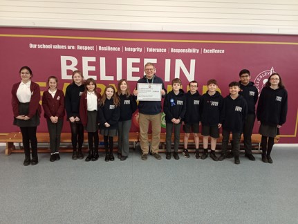 Wellesley Park Students with Rev Sam - A Wellington primary school has raised £1289.83 for a local food kitchen as part of a school exercise challenge