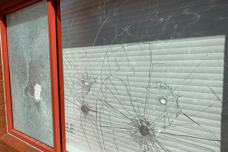 The smashed windows at Charlie Brown's Hair & Beauty