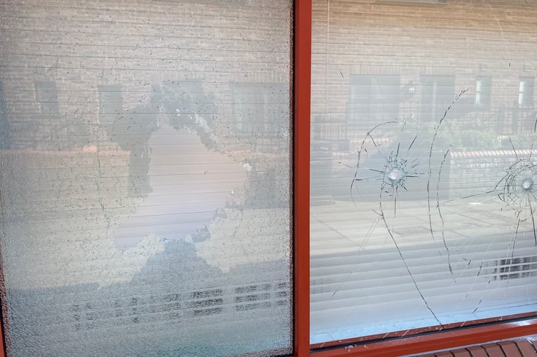 The smashed windows at Charlie Brown's Hair & Beauty