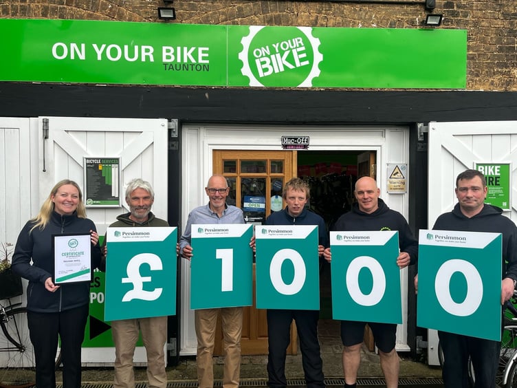 The cheque presentation of £1000 to On Your Bike from Persimmon Homes South West