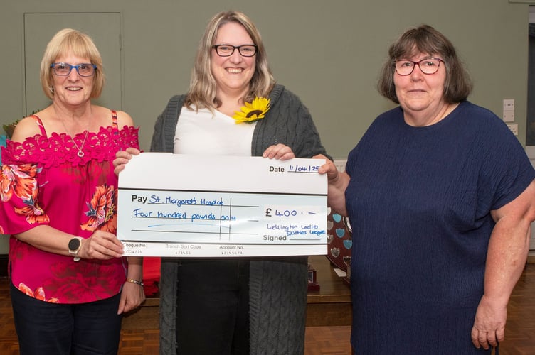 Chairperson Cathy Sharland (left) and secretary Jo Luckhurst (right) present £400 cheque to Holly Cashmore, of St Margaret's Hospice