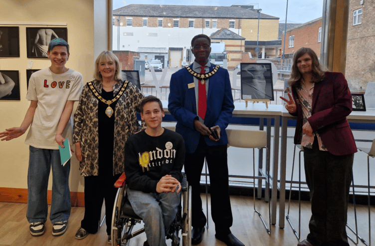 L-R: Connor Marchington, Taunton Mayor, Cllr  Vanessa Garside, Cody Marchington, Deputy Mayor Martin Straus, and Dyana French. The group gathered for the launch of the exhibition Disability is not Inability at Taunton Library on Wednesday, April 23