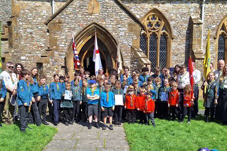 Members of Hemyock Scout Group outside St Mary's Church for a St George's Day service.