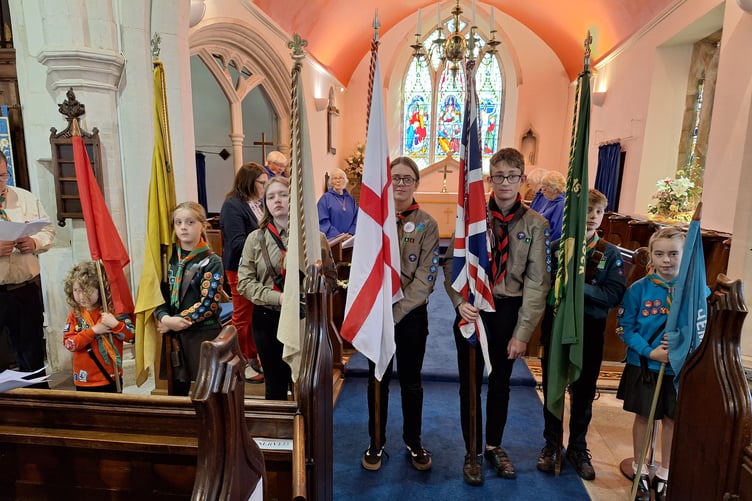 Flags on display during Hemyock Scout Group's St George's Day service in St Mary's Church.