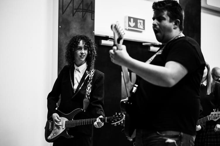 Zack / Guitar (James Redstone) and Dewey Finn (Michael Cole)