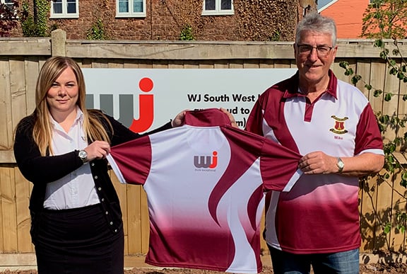 Kirstie Manning, Contract Manager of WJ South West Ltd, presents shirts to Wellington Bowling Club president Mike Groves