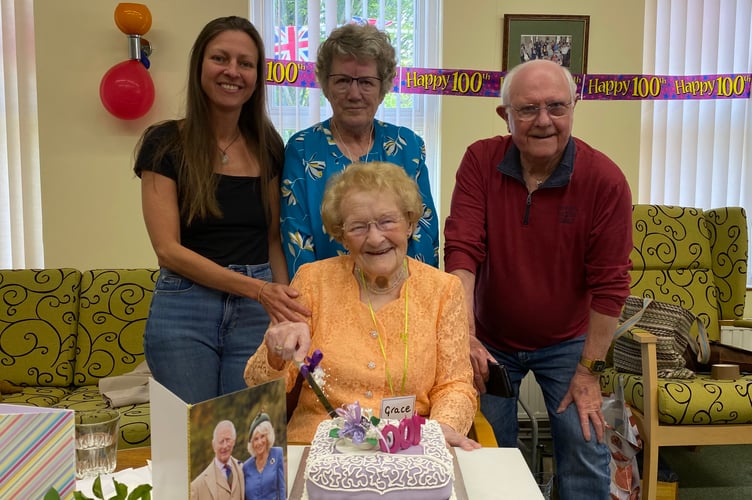 Grace's grand-daughter Helen, Susan Bellingham, and Grace's son David, stand with the woman of the hour