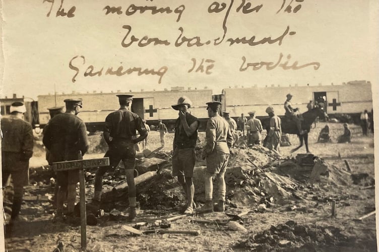 Caption reads: "The morning after the bombardment. Gathering the bodies"