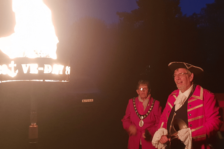 Wellington Mayor Cllr Janet Lloyd accompanied by town crier Andrew Norris lit a VE Day 80th anniversary beacon in Wellington Park.