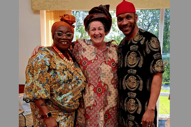 Justina, Anne Troake, and George – all in traditional Nigerian wear.
