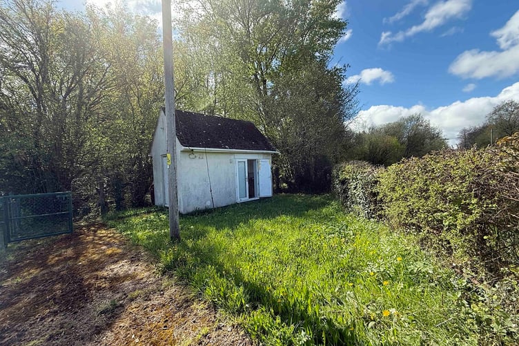 An old BT hut near Wiveliscombe which is to be auctioned as a holiday let.