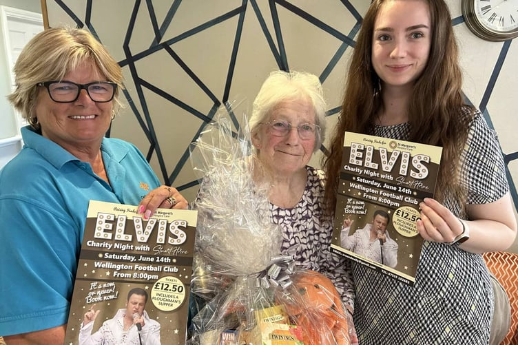 Oaktree care home resident Enid Loney is pictured holding its hamper with activity lead Nicky Perry (left) and deputy manager Clara Santamaria.