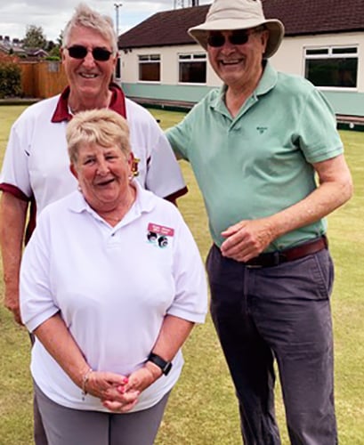 Coach Angie Moore (front) with helper Mike Groves and a new recruit (right).