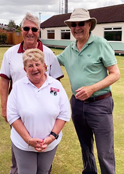 Coach Angie Moore (front) with helper Mike Groves and a new recruit (right).