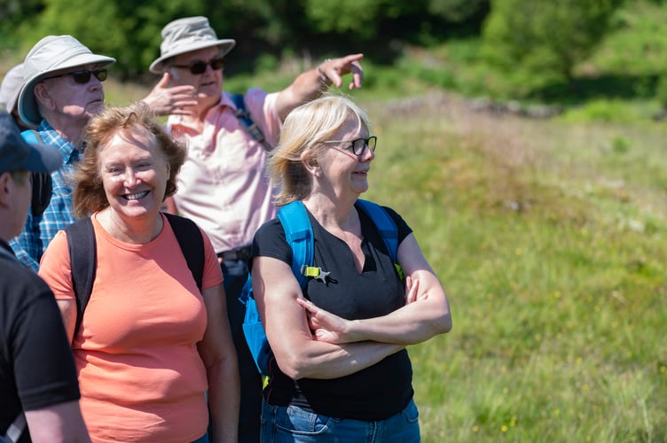 Visitors experiencing a guided walk around Tarn Hows, Cumbria