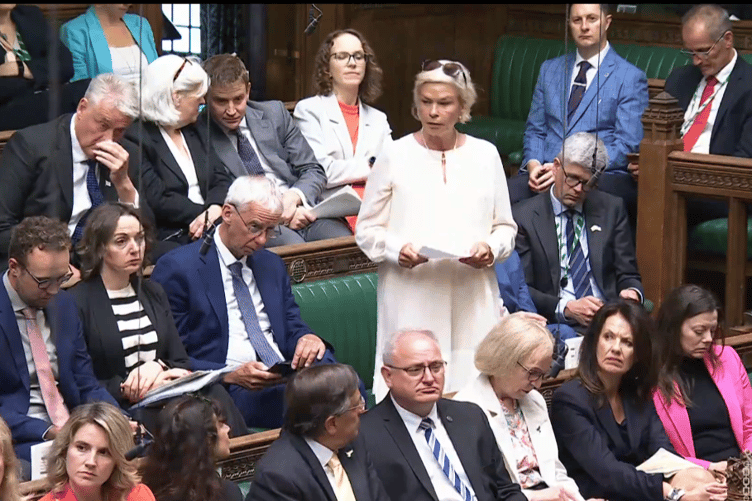 MP Rachel Gilmour puts a question on benefits access to the Prime Minister in the House of Commons.