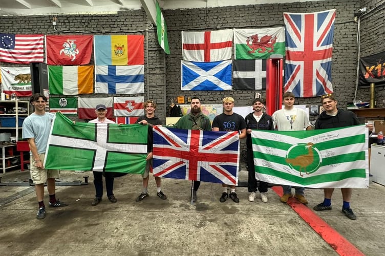 The group having arrived in Ukraine with the Devon and Wiltshire flags. L-R: Oscar Prior-Palmer, Hugh Prior-Palmer, Freddie Clayton, a friend made in Lviv, Harry Bishop, Guy Crofton, Hugo Dalley, and Ben Alvis