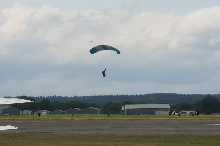 Tandem skydivers at Dunkeswell Aerodrome about to land.