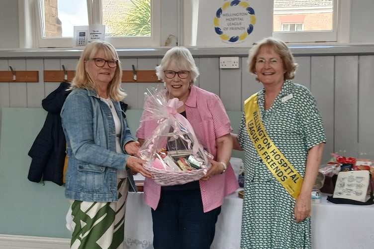 Raffle winner Wendy Deahl with by vice-chair Sue Alderman (left) and Martine Thurtle (right)