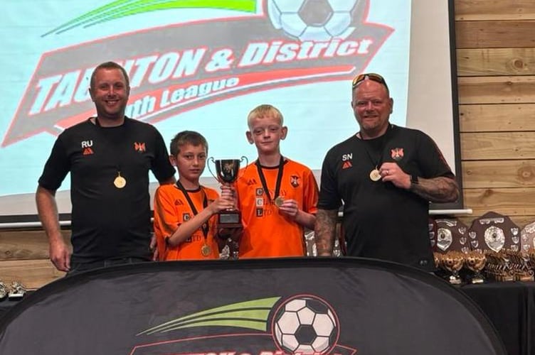 Manager Steve Newstead and coach Richard Upham with their sons Harry and Leo. 