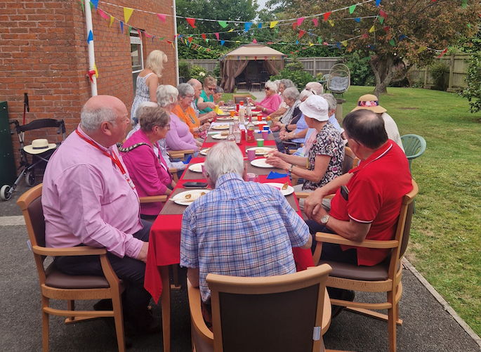 Wellington Mayor Cllr Janet Lloyd and chief executive Dave Farrow (left) joined Abbeyfield residents for a 'thank you' party after their homes were saved.