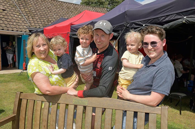Graham Spark's widow Deb (left) with family, including son Alex, at the bench presentation.