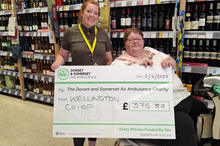 Kate from the air ambulance collectin £376.37 from a cake sale on 21st June by sisters Jean and Mary. 