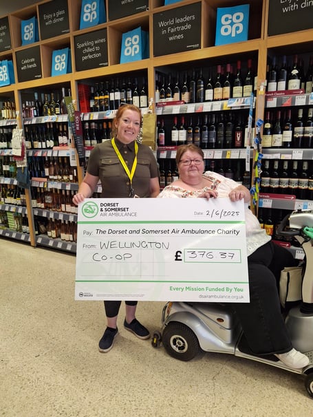 Kate from the air ambulance collectin £376.37 from a cake sale on 21st June by sisters Jean and Mary.