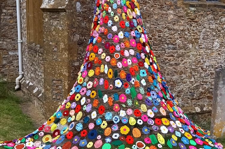 The Poppy Club hung a beautiful handcrafted Fall cascading from the church wall at the Hemyock fete