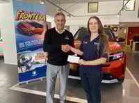 Car dealer sponsors charity head shave