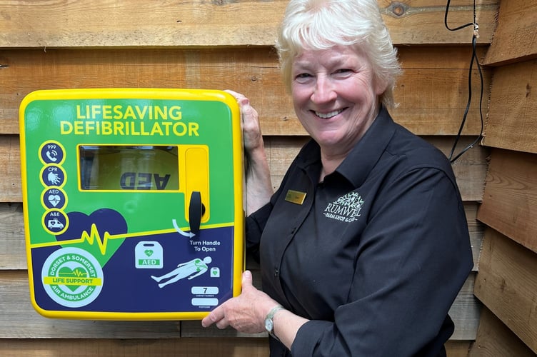 Anne Mitchell, Partner at Rumwell Farm Shop, with the newly installed defibrillator