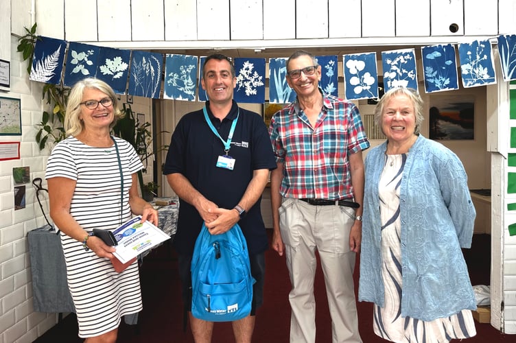 Water Guardians with Wessex Water representative in the Wellington Pop-Up Shop. L-R Martine Jaquemet, a Wessex Water representative, TBC, and Sue Rickard