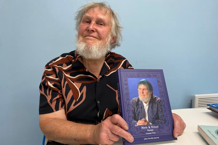 John Jarrett holding his new book 'Myth and Ritual Poems Volume Four'
