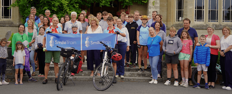 Charles and Mo Speyer are welcomed back to Queen's College after their marathon charity cycle ride.