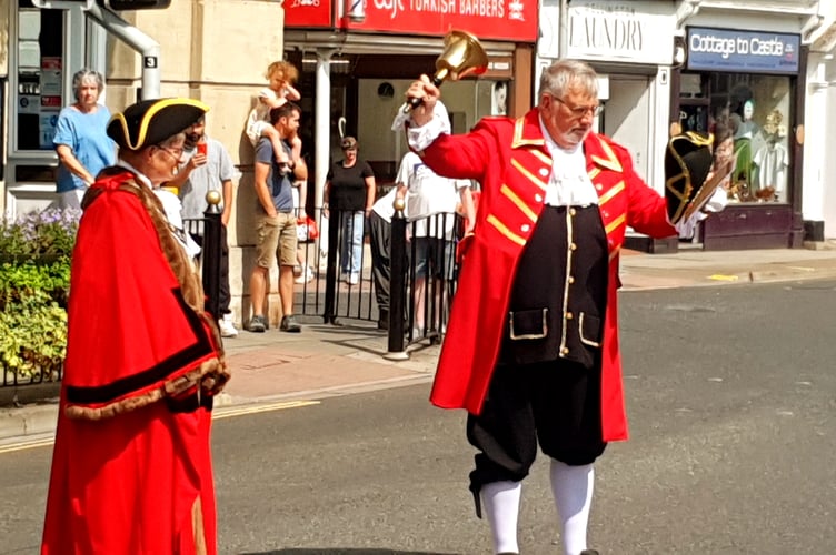 Wellington town crier Andrew Norris reads the VJ Day proclamation accompanied by the mayor Cllr Janet Lloyd.