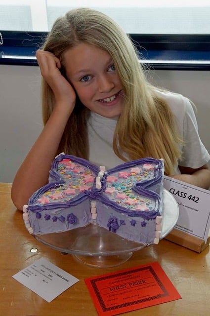 Eleven-year-old Elodie Avery with her decorated cake