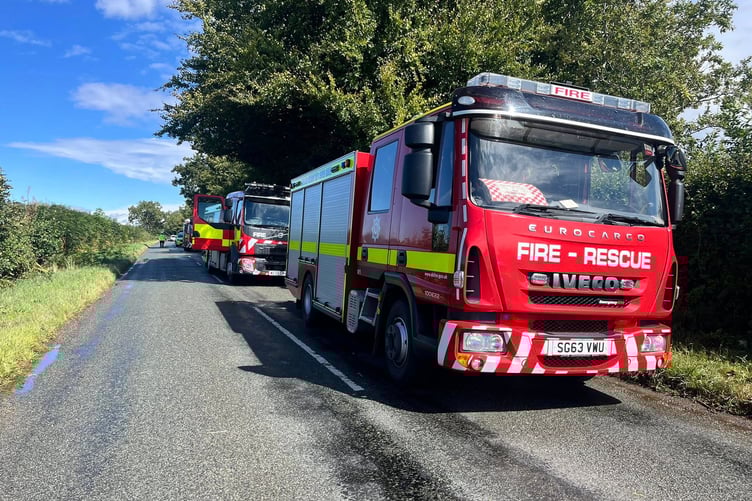 Two Taunton fire appliances are seen at the location of a serious car and lorry crash in Churchinford on August 27.